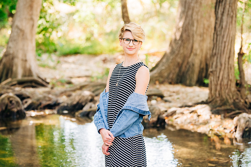 teen girl standing by pond in san antonio texas