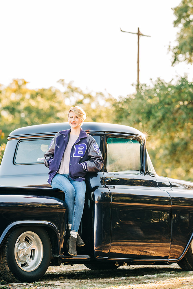 teen girl sitting on car in san antonio texas