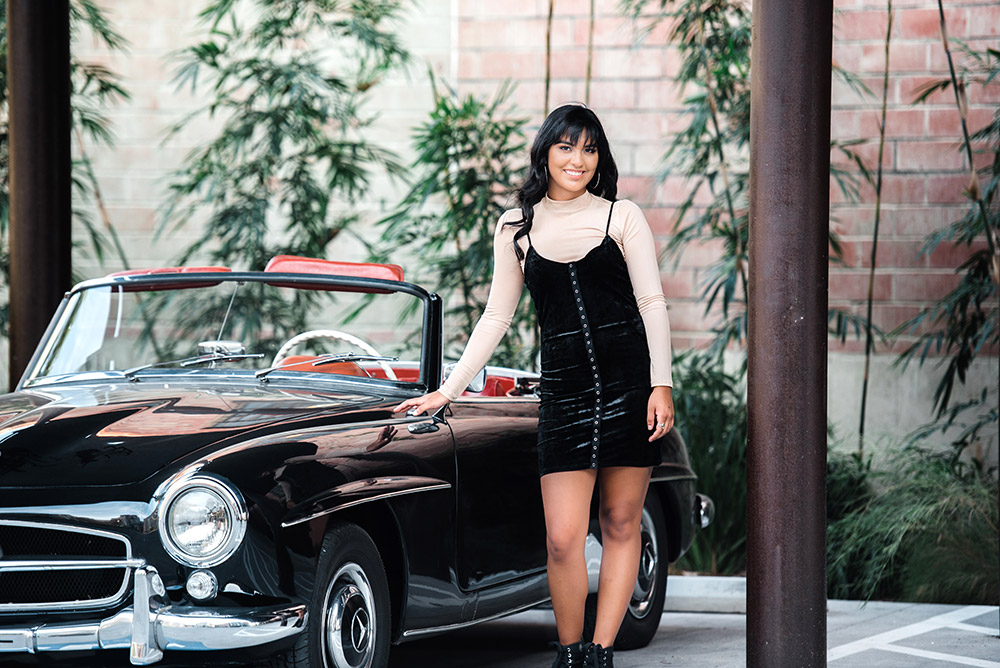 teen girl standing next to black car in san antonio texas