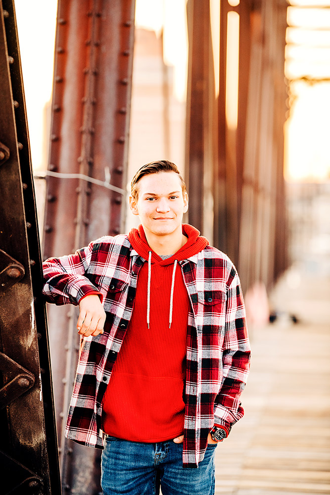 teen boy standing on bridge in san antonio texas