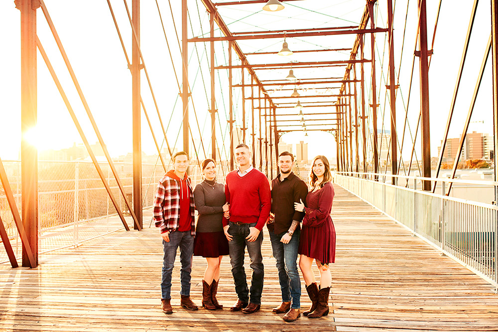 family standing on bridge in san antonio texas