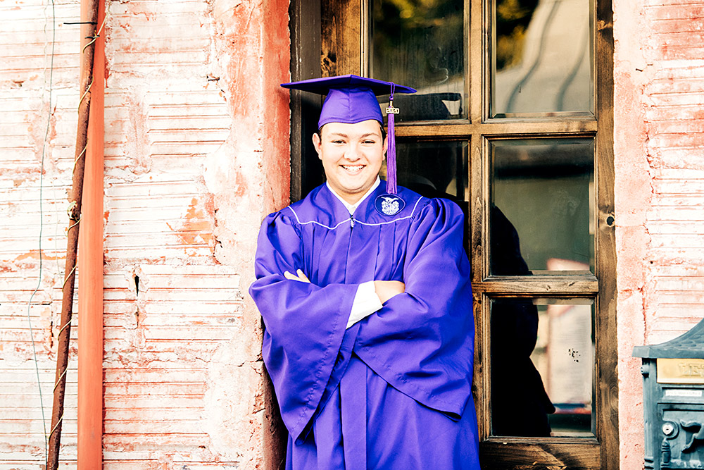 teen boy in purple cap and gown in san antonio texas